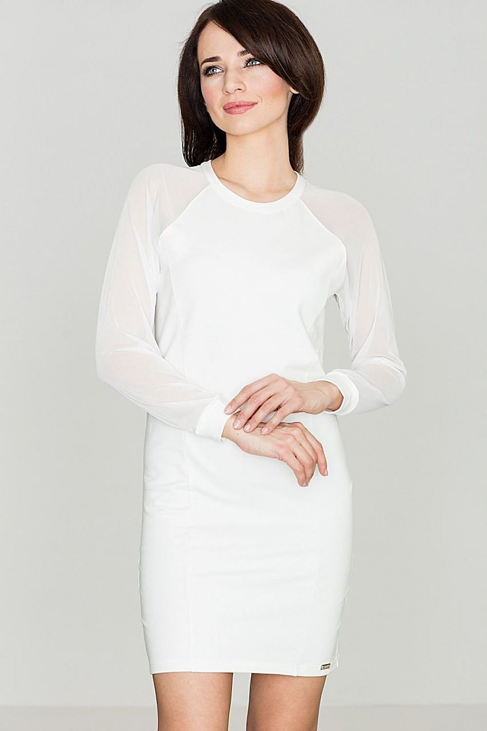 An elegant stretch cotton dress with raglan mesh sleeves, unlined and pocket-free for a chic, sporty look.

