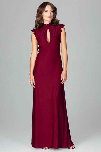 An elegant maxi dress fitted at the waist with slight flare at the bottom, featuring decorative frills on the shoulders and neckline, tied at the back, and buttoned at the top for a refined, feminine look.






