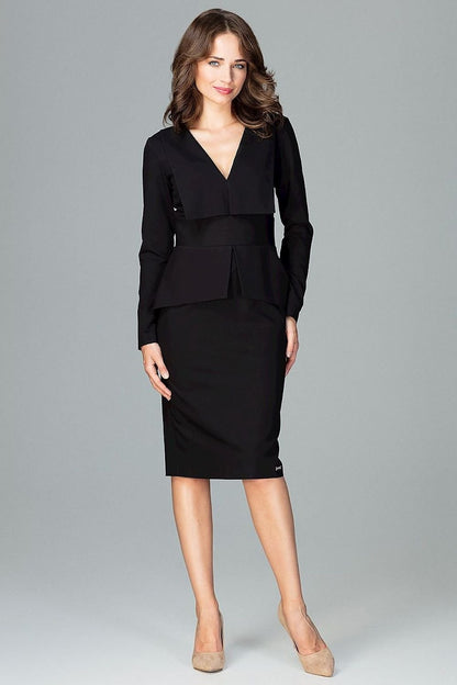 A knee-length dress with long sleeves, large lined lapels at the neckline, and a geometric Basque at the waist, featuring a back slit for added comfort and style.






