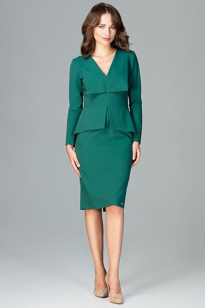 A knee-length dress with long sleeves, large lined lapels at the neckline, and a geometric Basque at the waist, featuring a back slit for added comfort and style.






