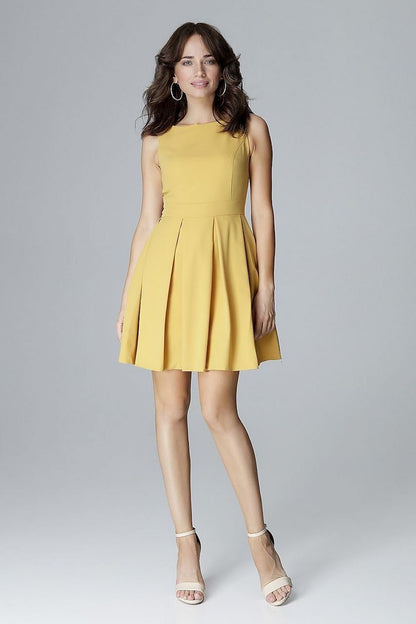 A sleeveless yellow dress with a fitted top, low feminine neckline, and a waist-cut design with a flared bottom arranged in wide folds, perfectly emphasizing and slimming the waist.






