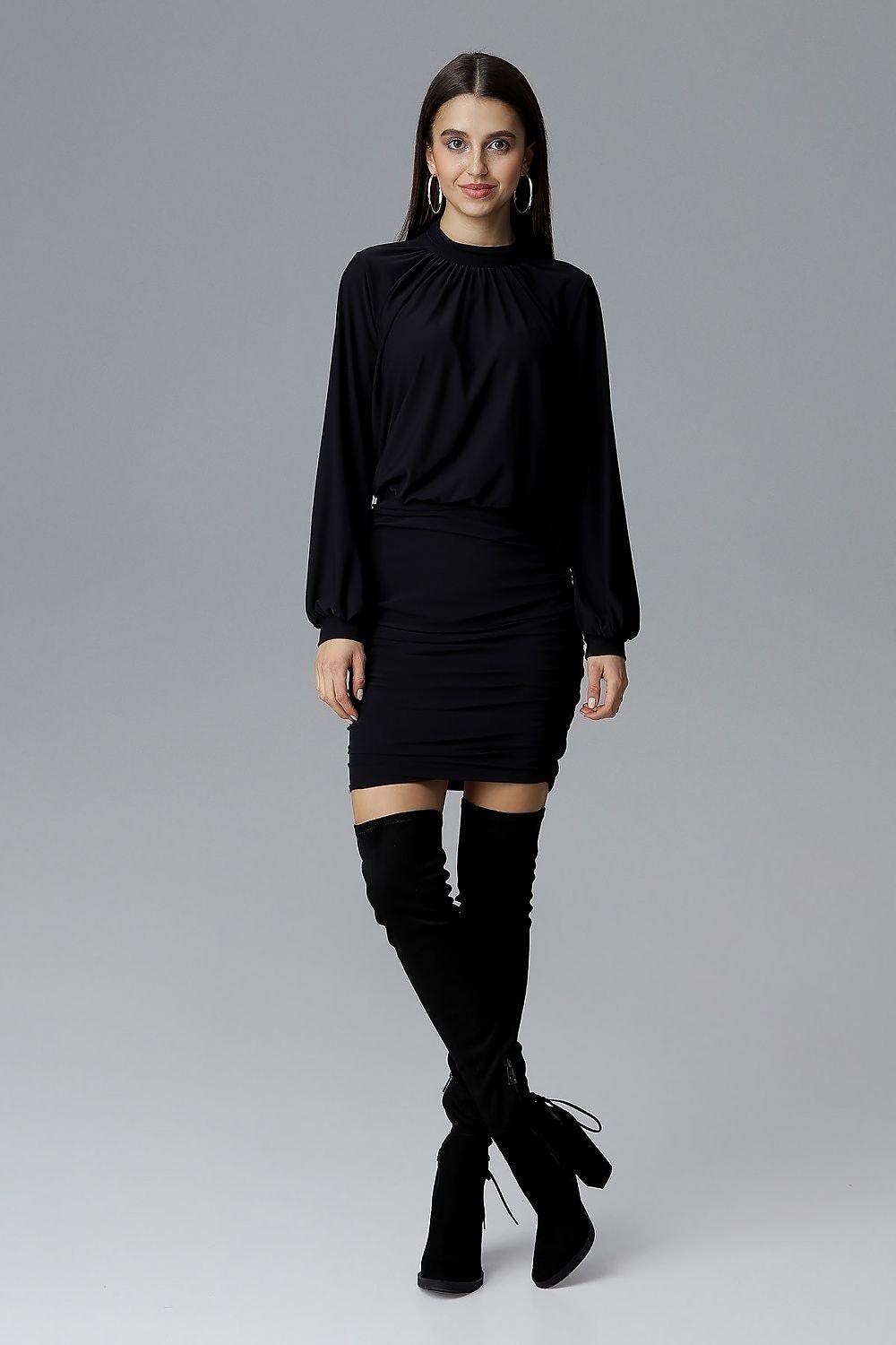 black elegant dress with long wide sleeves finished with a cuff, pleated neckline, side pleats at the bottom, and a covered zipper at the back, perfect for an evening out.






