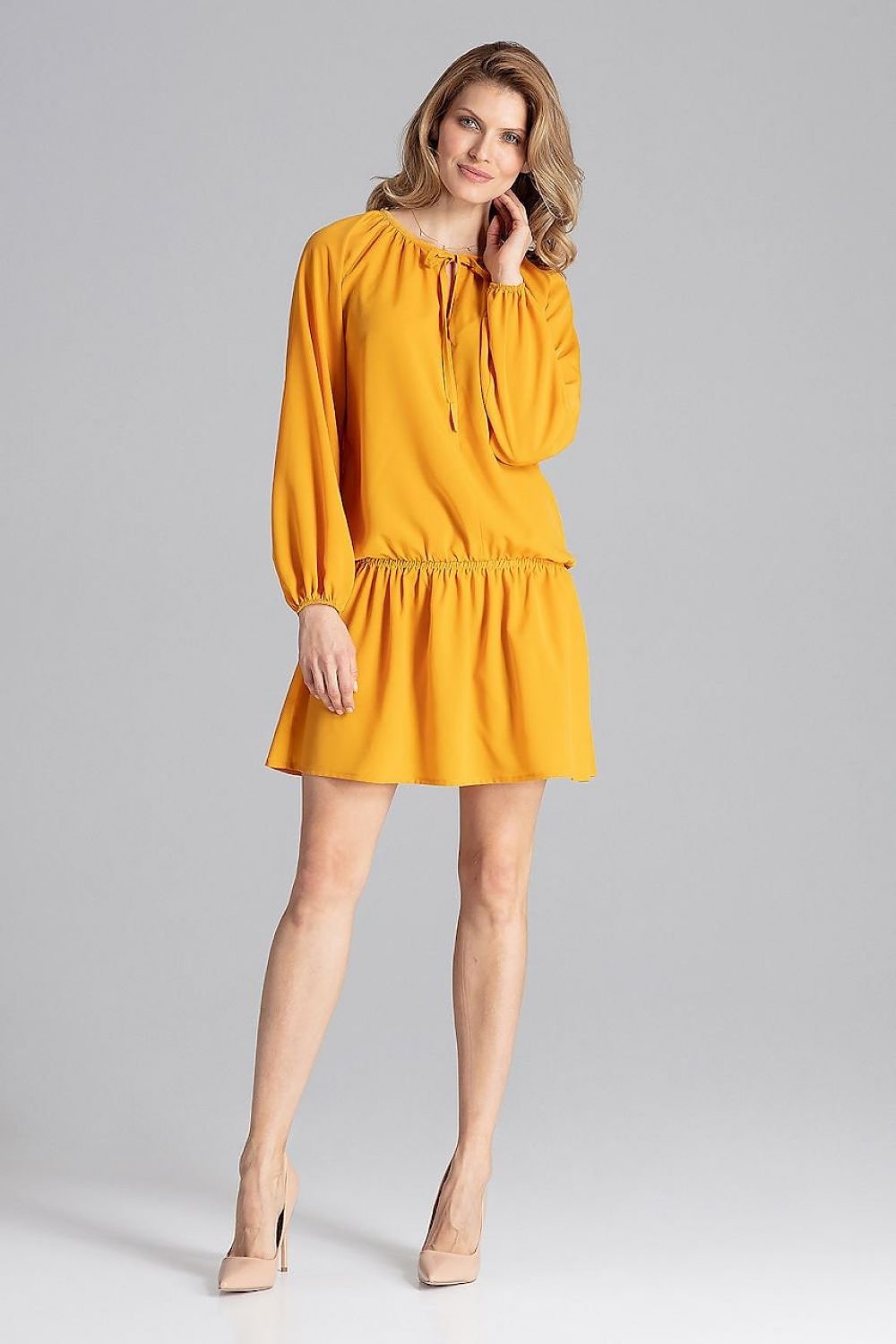 Comfortable yellow color loose-fitting dress with long sleeves and a delicate elastic band at the hips. Featuring an adjustable neckline with binding and long sleeves finished with elastic cuffs for a perfect fit. Ideal for relaxed, stylish wear.






