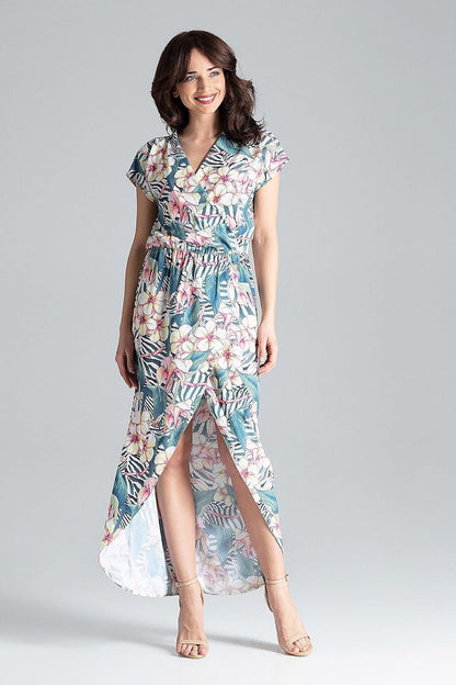 A long dress featuring kimono sleeves, an elastic waist, intertwined top and bottom cut to the right side, and a front slit, combining style and elegance for various occasions.






