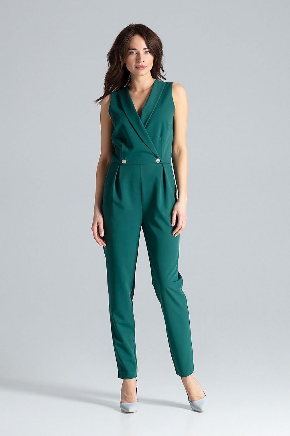 Classic sleeveless jumpsuit featuring lined narrow lapels, an envelope neckline, back zipper closure, waist darts, slanted side pockets, and silver-tone decorative snap fasteners.






