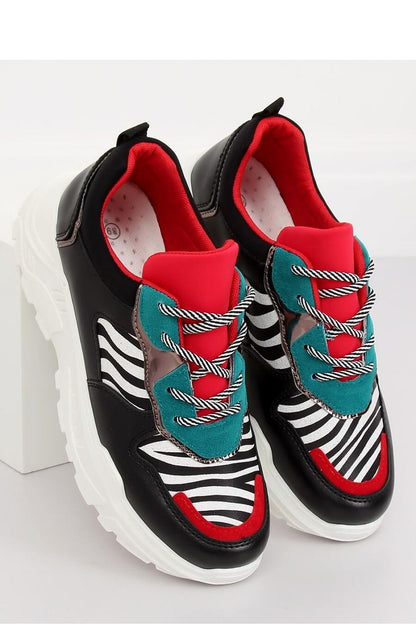 Eye-catching women's sports shoes featuring a trendy high sole and bold zebra motif. Made from ecological leather and suede, these sneakers combine comfort with a striking color combination, making them a perfect addition for those who want to stay on trend.






