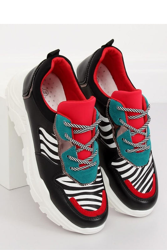 Eye-catching women's sports shoes featuring a trendy high sole and bold zebra motif. Made from ecological leather and suede, these sneakers combine comfort with a striking color combination, making them a perfect addition for those who want to stay on trend.






