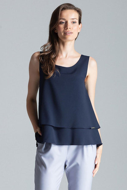 Sleeveless double-layer blouse with a patterned design, half-round neckline, and a flared bottom for a flattering fit.