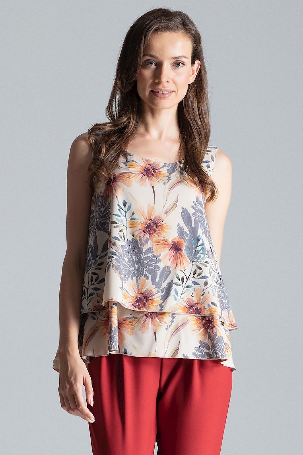 Sleeveless double-layer blouse with a patterned design, half-round neckline, and a flared bottom for a flattering fit.