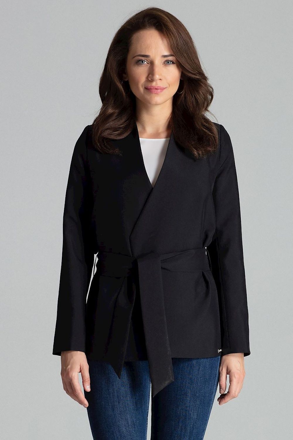 A simple jacket featuring an asymmetrical front and no button closure, with a sash tie at the waist for a refined fit. Lined in the same color as the jacket, this sleek design has no pockets, offering a minimalist and elegant look perfect for versatile styling.