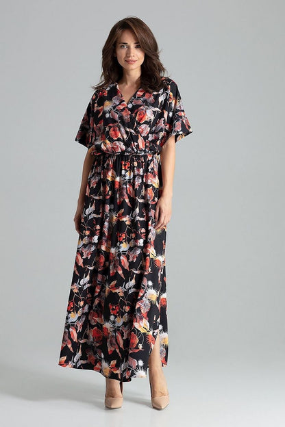 Elegant long floral dress featuring short kimono sleeves with cuffs, an envelope neckline, and a waist with sewn-in elastic for a flattering fit. The slightly flared skirt with side slits adds movement and style, making this dress perfect for both casual and formal occasions.