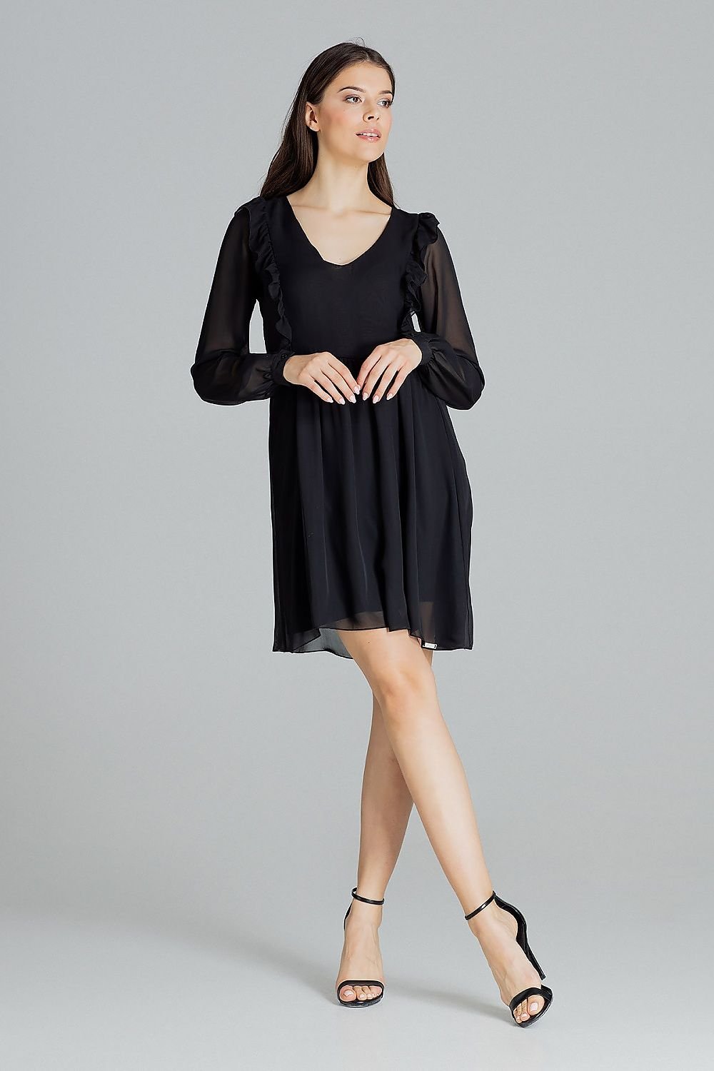 A loose-fitting black chiffon midi dress with long ruffled sleeves, button cuffs, a serek neckline, and decorative vertical frills on the front and back, seamed at the waist with a slip at the bottom, no fastening.






