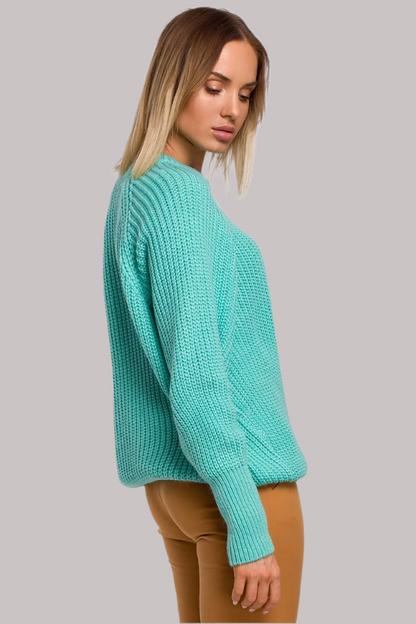 Elevate your everyday wardrobe with this timeless sweater, featuring a classic ribbed knit design. The wide sleeves add a contemporary touch, while the versatile neckline complements a variety of styles.

