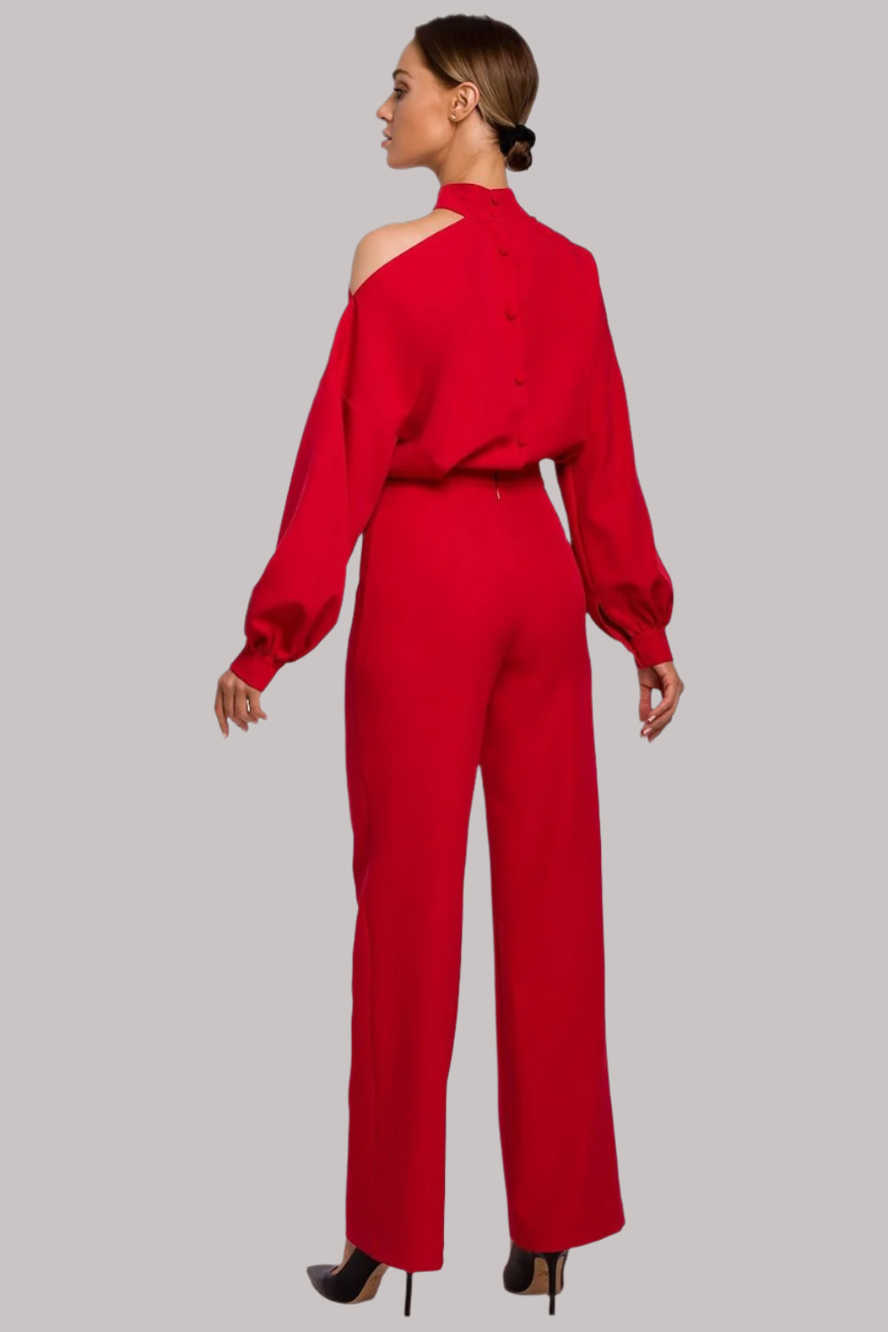 Elegant jumpsuit with long buffet sleeves, asymmetric neckline with a slit over one shoulder, and covered zip and button fastening. Perfect for big events.






