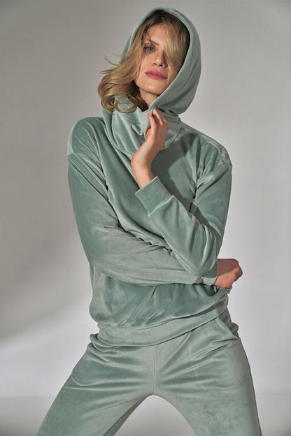  Women's velour hoodie with a loose collar, long sleeves, and ribbed hem detailing for a comfortable and stylish fit. Perfect for casual wear with a soft and luxurious feel.