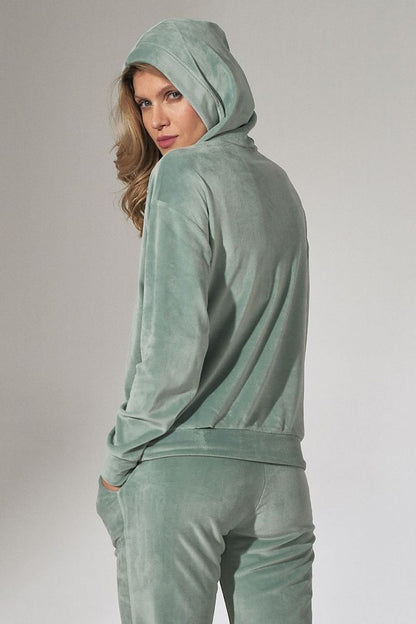  Women's velour hoodie with a loose collar, long sleeves, and ribbed hem detailing for a comfortable and stylish fit. Perfect for casual wear with a soft and luxurious feel.