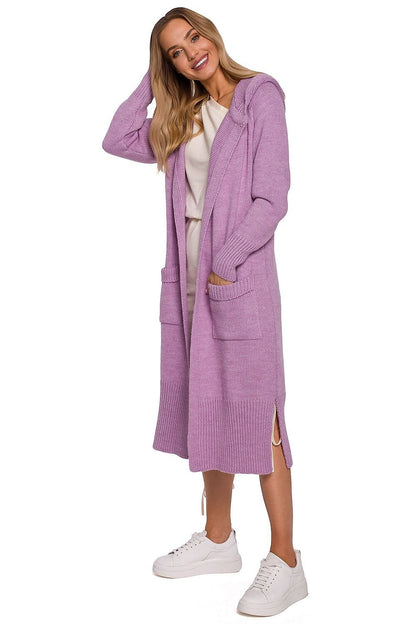 A cozy, coat-like cardigan made from soft yarn, featuring a large, fitted hood, two large front pockets with tabs, and decorative slits on the sides. Unbuttoned design for a relaxed, stylish look.