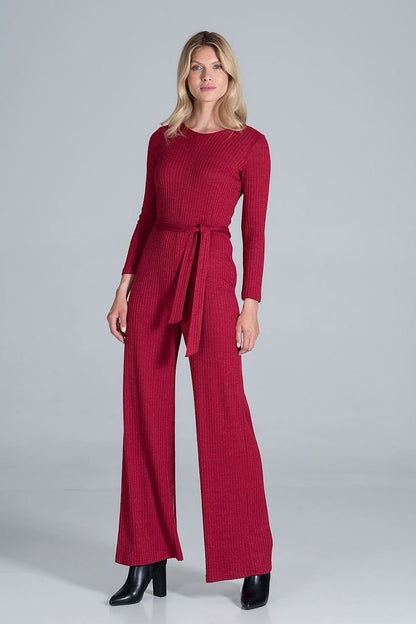 Elegant  red long-sleeved jumpsuit in flowing ribbed knit fabric, featuring wide legs and a back slit with snap button fastening for a sophisticated look.






