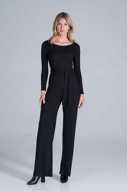 Elegant long-sleeved jumpsuit in flowing ribbed knit fabric, featuring wide legs and a back slit with snap button fastening for a sophisticated look.






