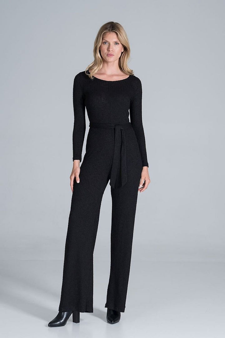 Elegant long-sleeved jumpsuit in flowing ribbed knit fabric, featuring wide legs and a back slit with snap button fastening for a sophisticated look.






