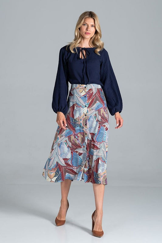 A classic trapeze midi skirt, buttoned at the front, designed without pockets and unlined, offering a sleek and elegant look.
