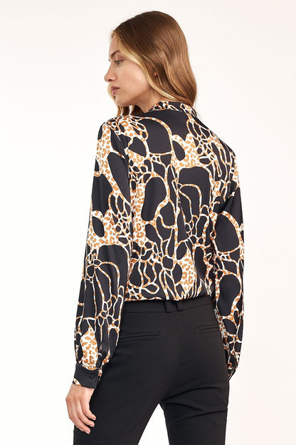 Elegant blouse with a bold front pattern, perfect for diversifying classic outfits. Pair it with a black jacket and trousers for a unique, stylish look. Add color and flair to your wardrobe with this eye-catching piece.