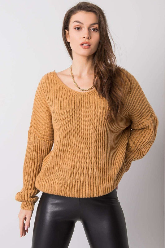 Add a touch of elegance to your everyday look with this brown sweater featuring a unique back neckline. Designed for versatility, it pairs effortlessly with jeans, skirts, or tailored trousers, making it ideal for casual gatherings or refined occasions. Comfort meets sophistication in this timeless wardrobe essential.

