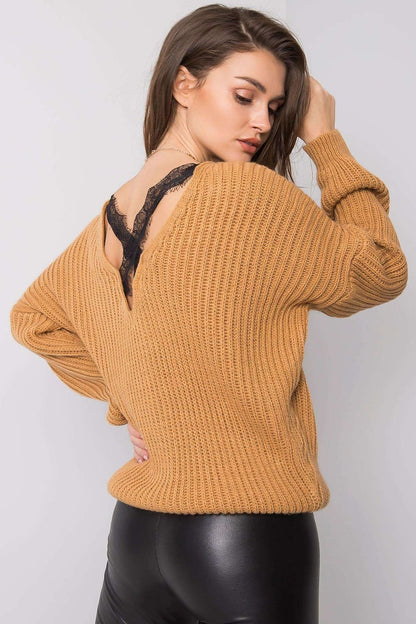 Add a touch of elegance to your everyday look with this brown sweater featuring a unique back neckline. Designed for versatility, it pairs effortlessly with jeans, skirts, or tailored trousers, making it ideal for casual gatherings or refined occasions. Comfort meets sophistication in this timeless wardrobe essential.

