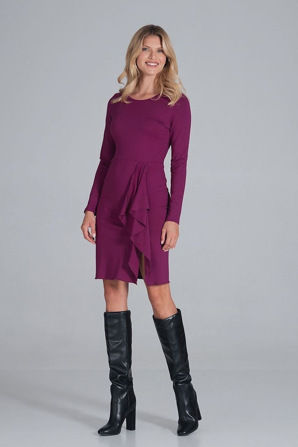 A purple cocktail dress with long sleeves, a half-round neckline, and a straight bottom with drapery on the left leg, offering an elegant design without a fastener.






