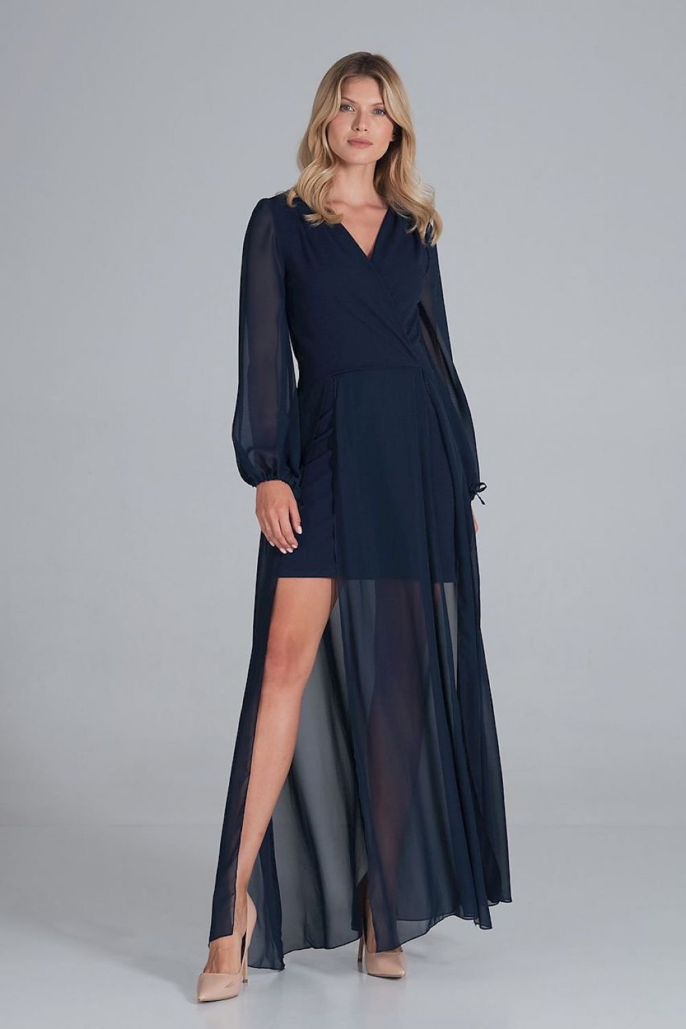 A cocktail maxi dress featuring an envelope neckline, long chiffon sleeves with bindings, and a two-layer bottom—mini dress underneath with a chiffon maxi layer featuring front slits for added elegance.






