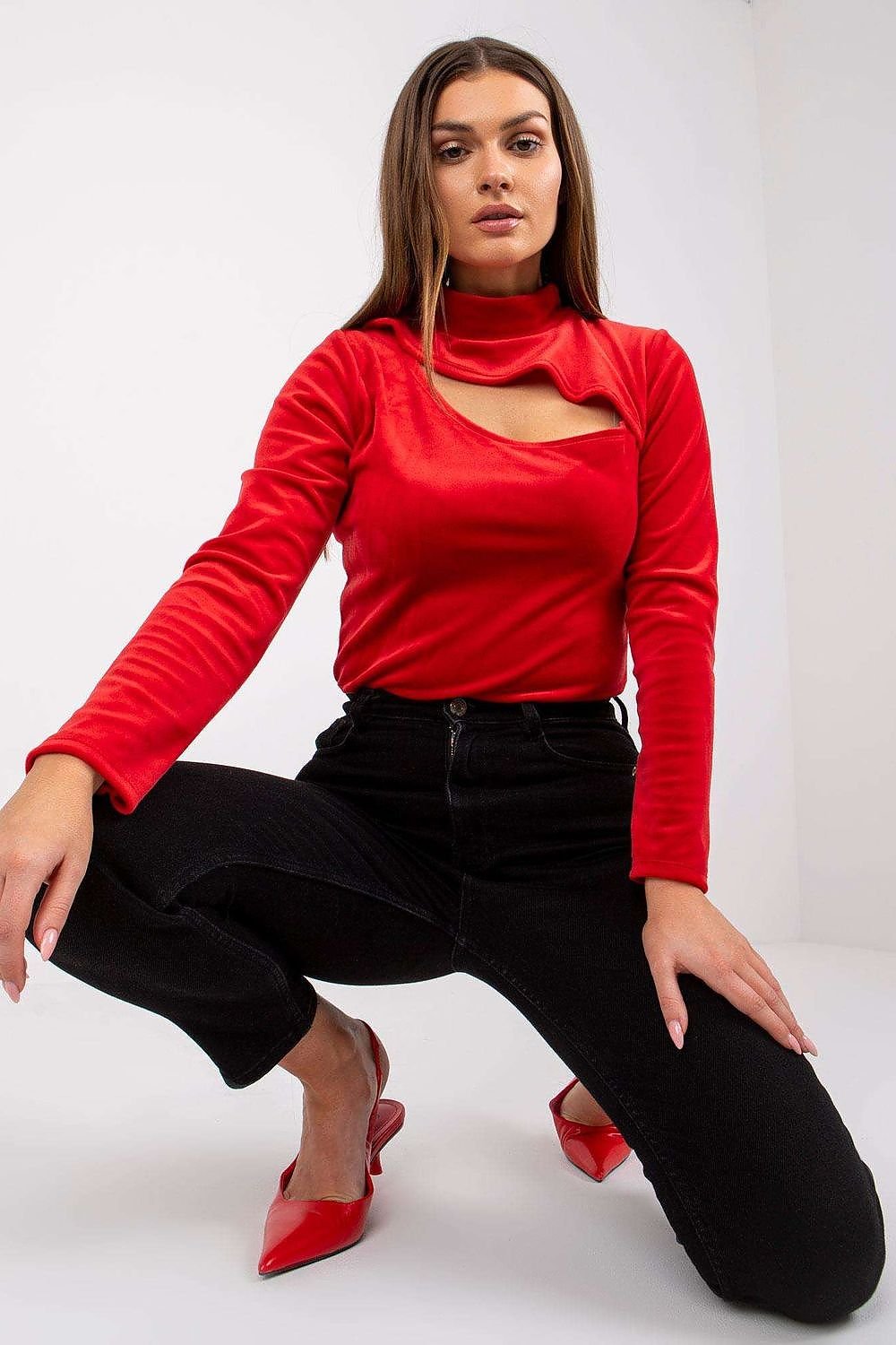 Stylish long sleeve velour blouse with a stand-up collar and a unique front cut-out for a modern, elegant look.
