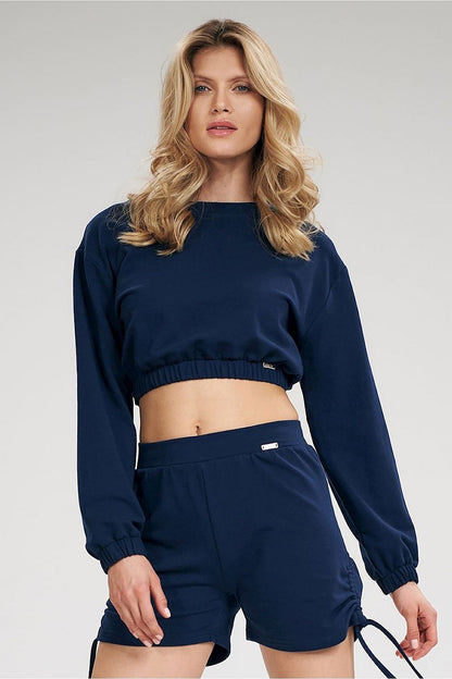 A trendy long sleeve crop sweatshirt featuring a half-round neckline, with sleeves and bottom hem finished with a wide elastic band for a comfortable and modern fit. Perfect for casual, stylish looks.






