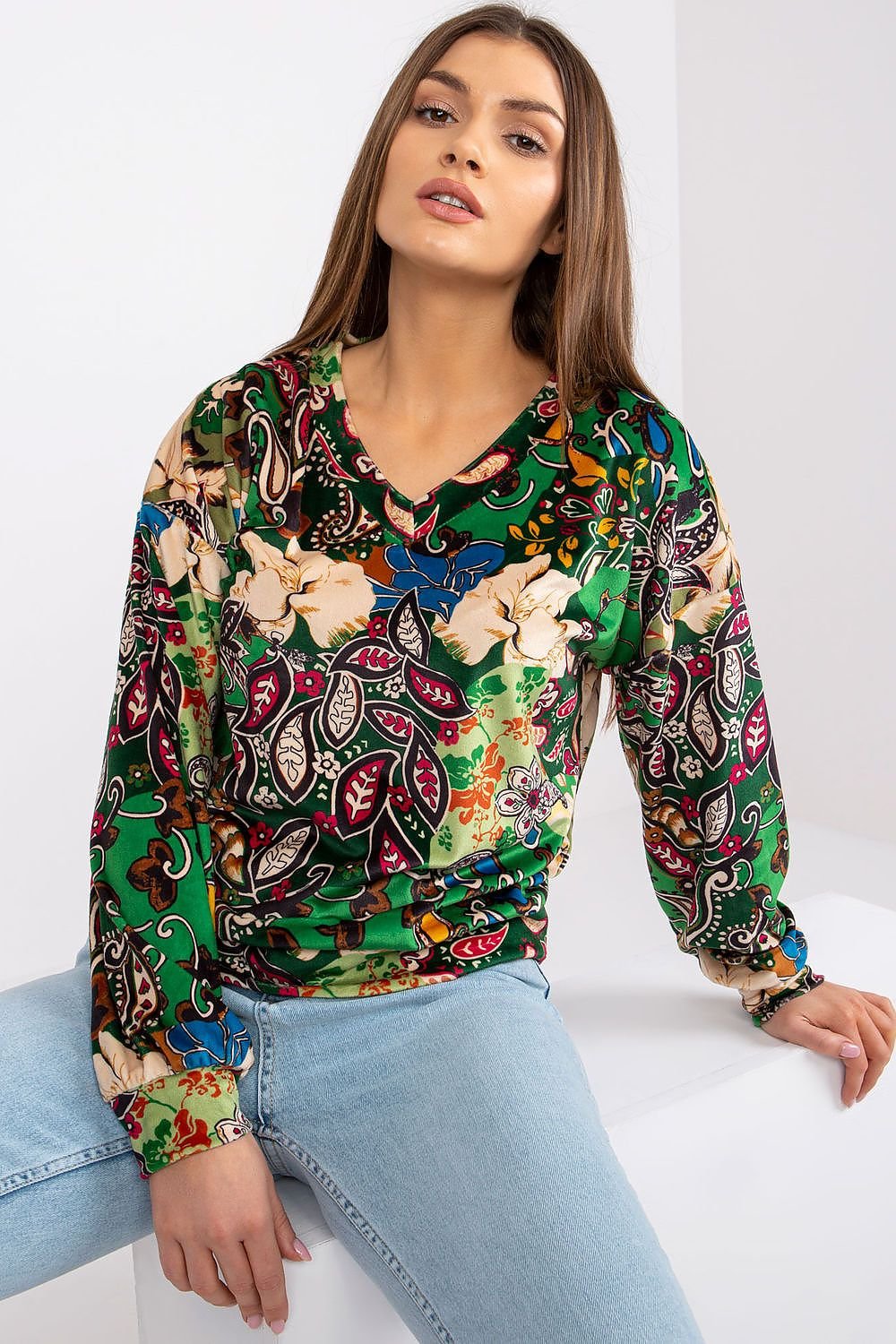 Chic long sleeve blouse with a V-neckline and unique fabric pattern, perfect for adding a touch of style to any occasion