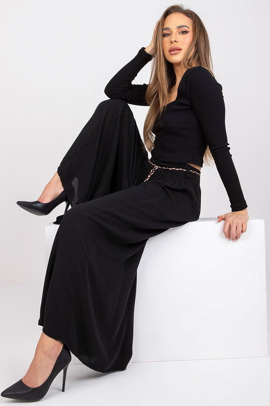 High-waisted viscose pants with an elastic waistband for comfort. Featuring wide legs and a decorative tie belt for a stylish, adjustable fit.

