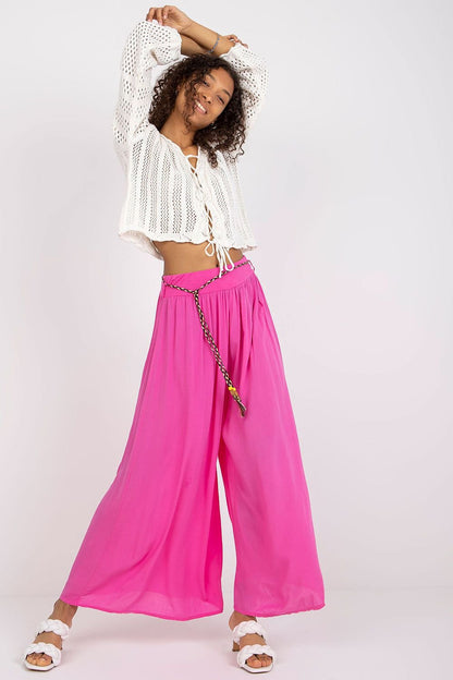 High-waisted viscose pants with an elastic waistband for comfort. Featuring wide legs and a decorative tie belt for a stylish, adjustable fit.

