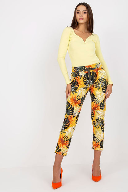 Women's sweatpants featuring an elastic waistband with a drawstring tie and slide pockets on the sides. Made from patterned fabric for a stylish and comfortable fit.






