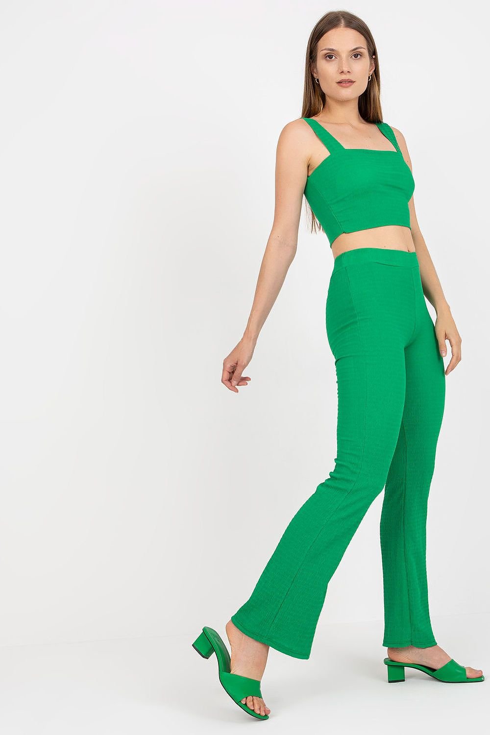 A set featuring a green short top with padded cups and a rectangular neckline, paired with high-waisted long pants with wide legs and an elastic waistband for a comfortable fit.






