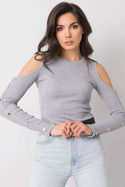 Elegant fitted blouse made of ribbed fabric with long sleeves, offering a flattering and stylish fit.