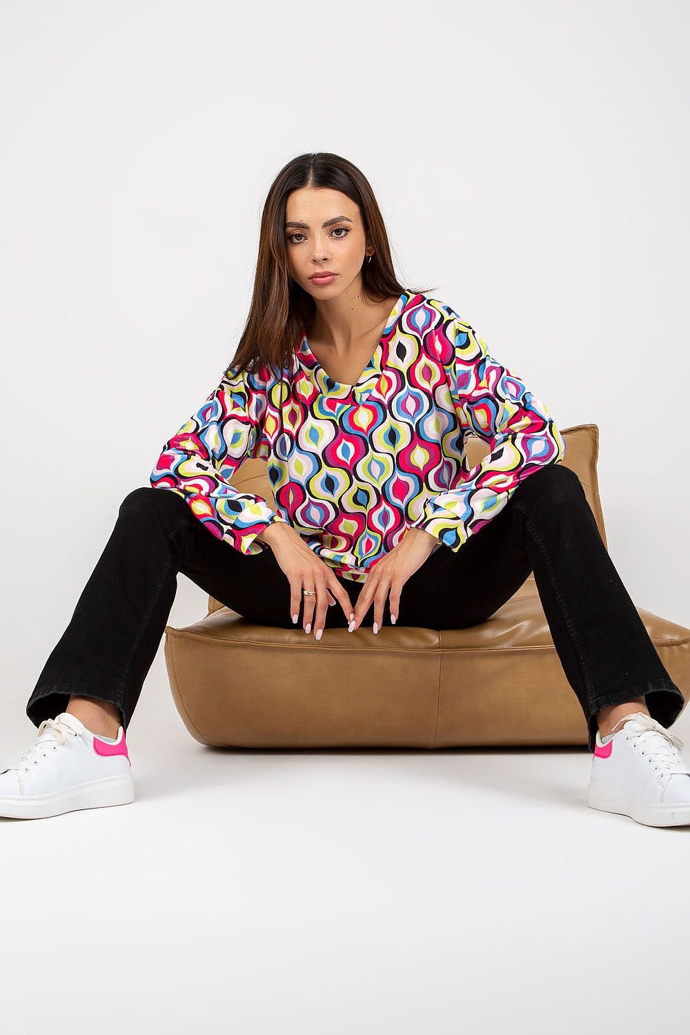 A women's sweatshirt with long sleeves, a distinctive heart-shaped neckline, and a unique patterned fabric, combining comfort and style for a standout look. Perfect for casual wear.






