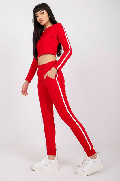 Casual set featuring a short blouse with long sleeves, a round neckline, and contrasting striped patterns on the sleeves, paired with matching long pants with slip pockets. Ideal for comfortable, everyday wear, this set combines style and practicality.