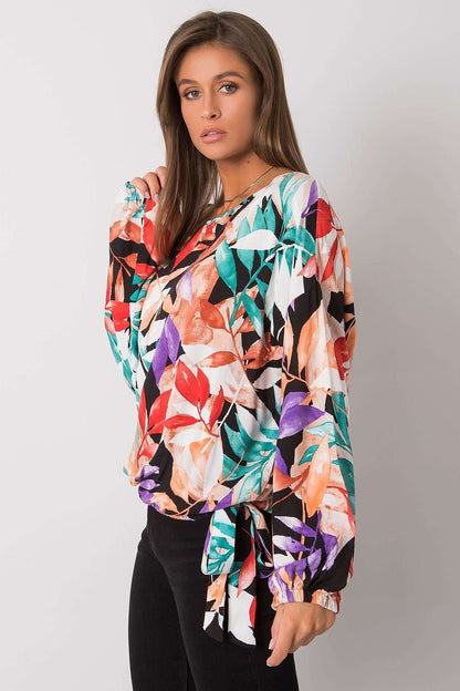 Loose fit blouse with long sleeves, round neckline, and decorative side binding for a stylish and relaxed look.