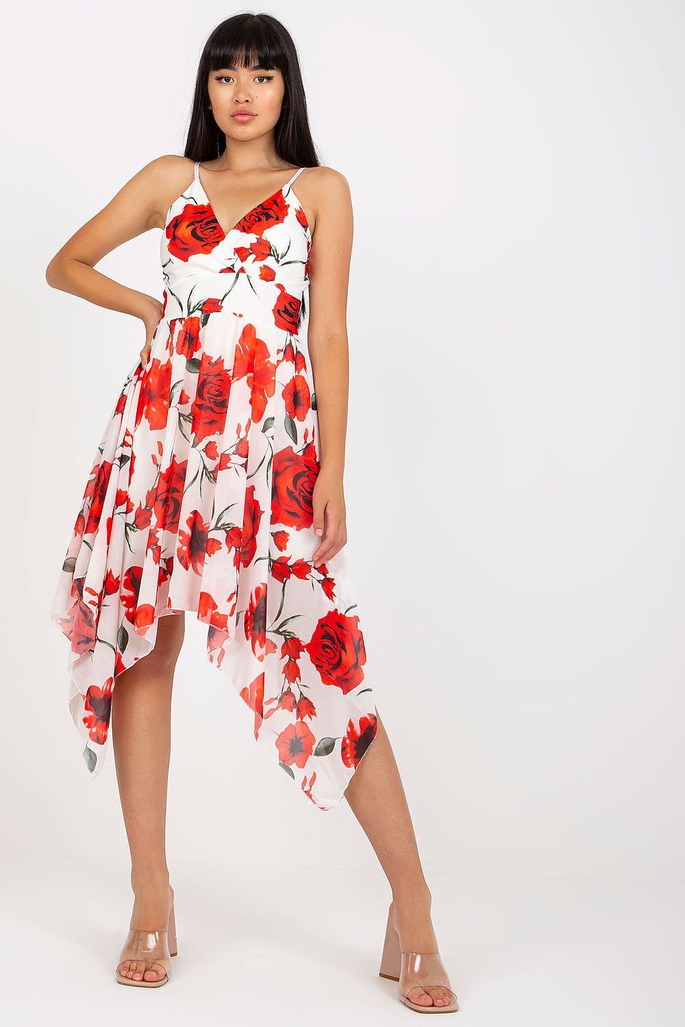 A charming roses floral summer dress featuring adjustable straps, an envelope neckline with sewn-in padded cups, and an asymmetrical hem. Lined for comfort, this dress is perfect for warm weather and casual outings.






