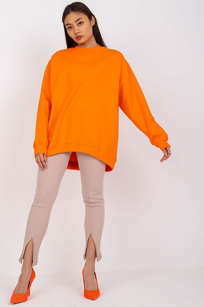 A women's orange cotton sweatshirt with long sleeves and a stand-up collar, crafted from high-quality, breathable material for exceptional comfort. Ideal for pairing with tight pants or skirts for a stylish and versatile look.






