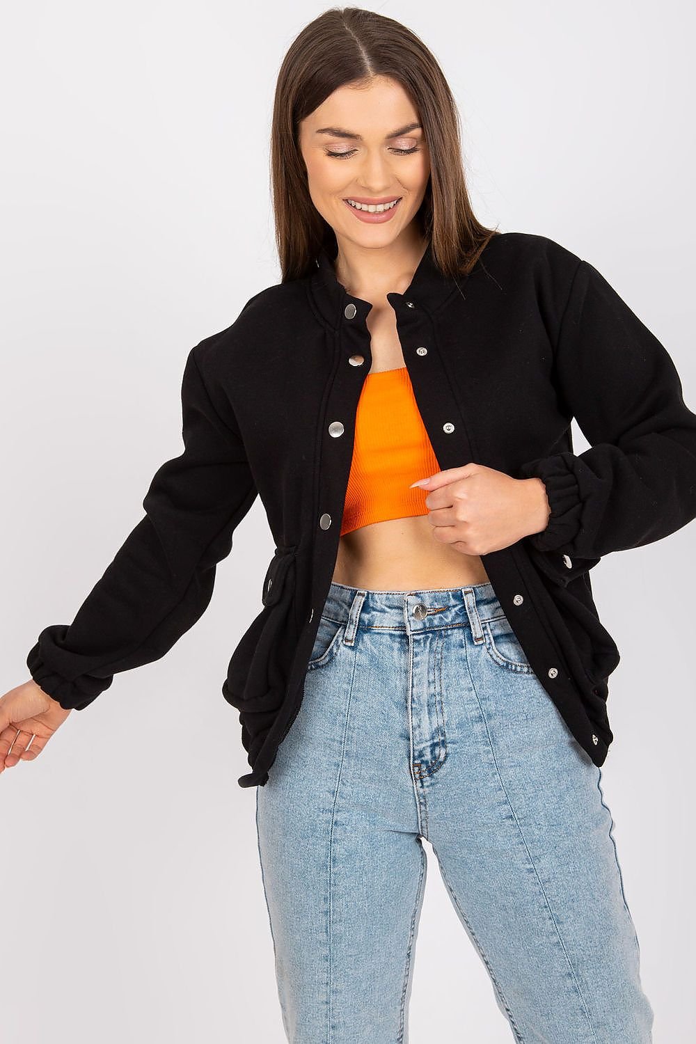 A women's long-sleeve sweatshirt without a hood, featuring press-stud fastenings and snap-secured front pockets. A versatile and stylish piece for casual wear.






