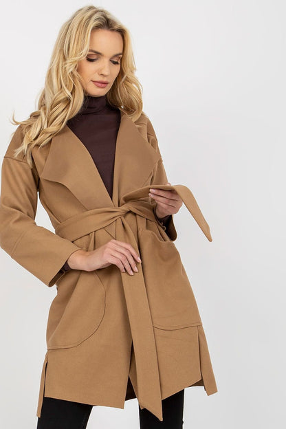 Sleek unlined women's coat with long sleeves, tie belt, and large side patch pockets for a chic, layered look.






