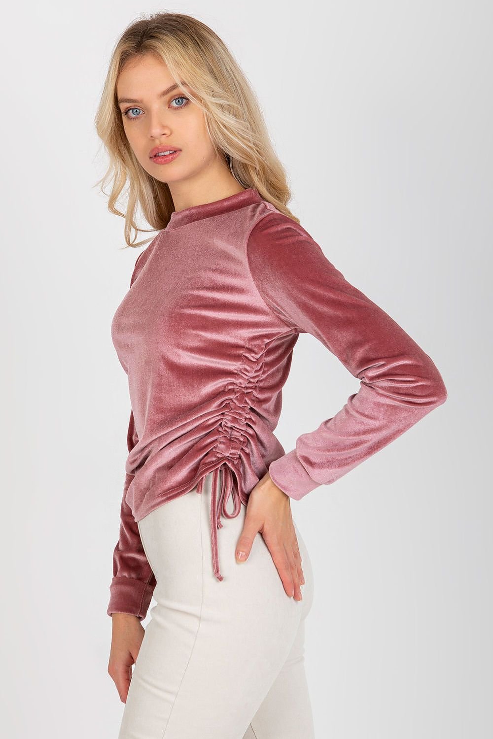 Stylish short velour blouse with long sleeves, round neckline, and adjustable side ties for a customizable fit.