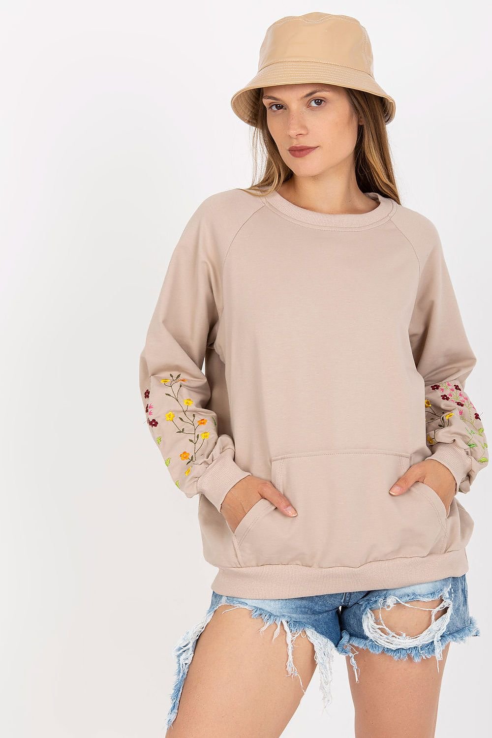 A women's sweatshirt featuring long sleeves, a kangaroo pocket, and decorative embroidery on the sleeves, offering both comfort and style.






