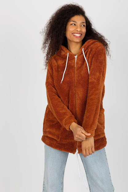 A cozy zip-up sweatshirt with a soft fur lining, a hood for added warmth, and large sewn-in slip pockets for practicality. Perfect for staying warm and stylish on chilly days.






