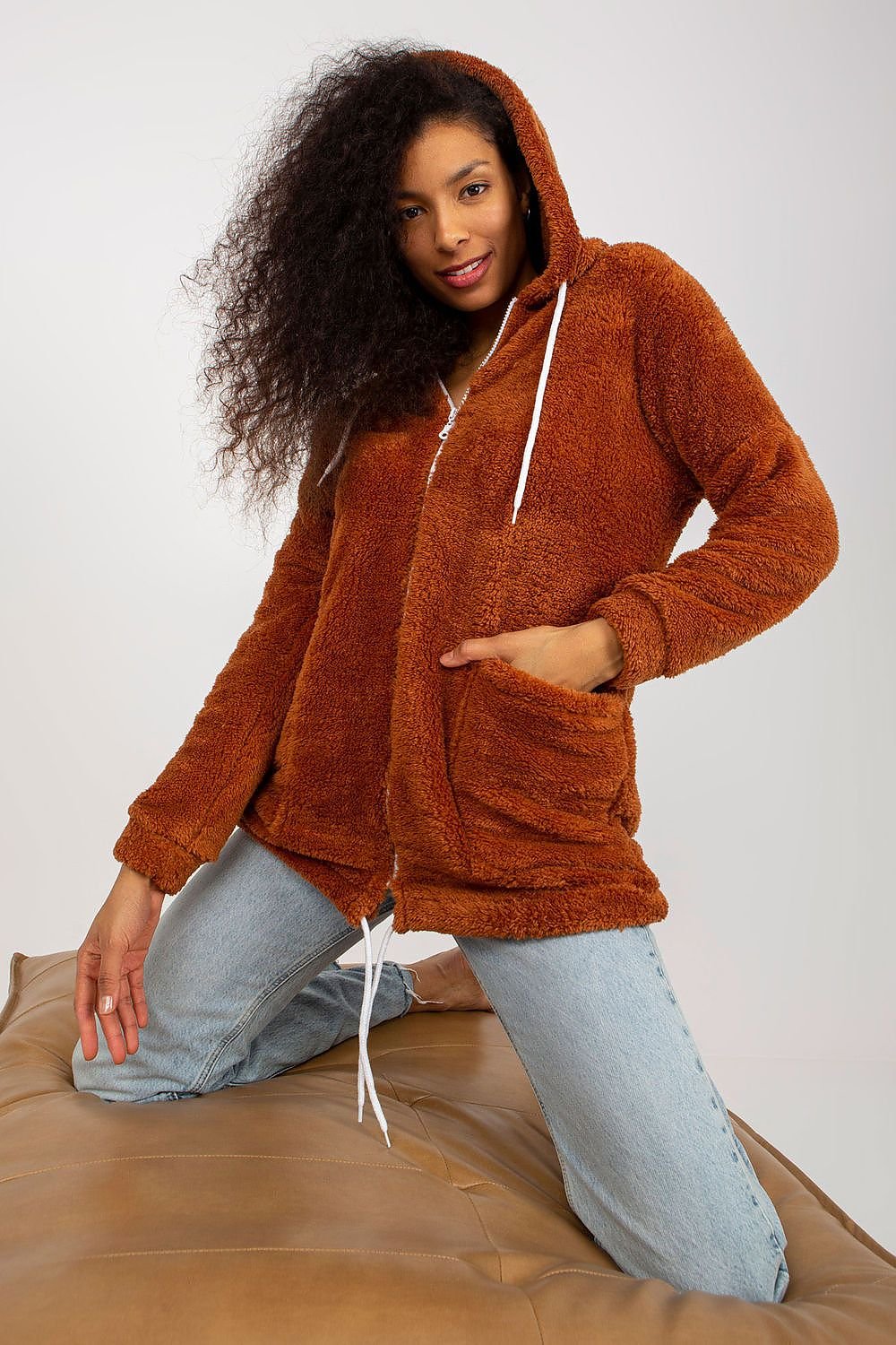 A cozy zip-up sweatshirt with a soft fur lining, a hood for added warmth, and large sewn-in slip pockets for practicality. Perfect for staying warm and stylish on chilly days.






