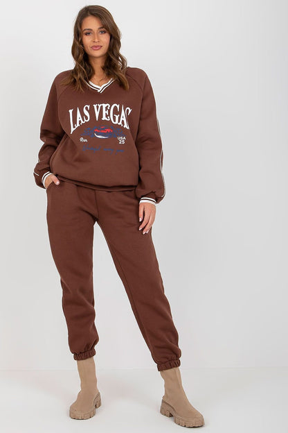 LAS VEGAS PRINT A casual set featuring a long-sleeve sweatshirt with a heart-shaped neckline, paired with long pants with a waist tie and slip pockets, offering comfort and style with a Las Vegas-inspired design.